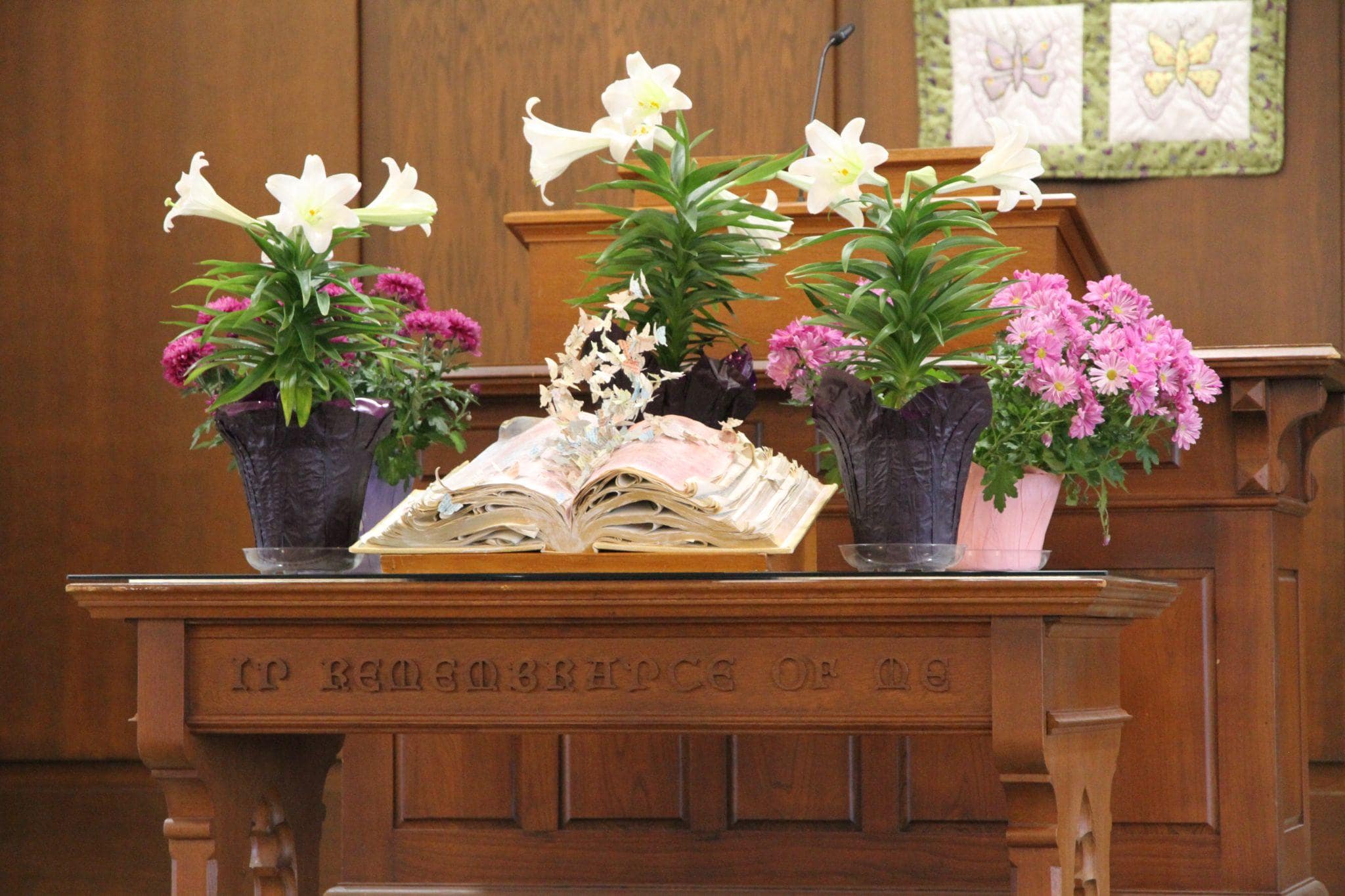 Communion table with flowers and Bible